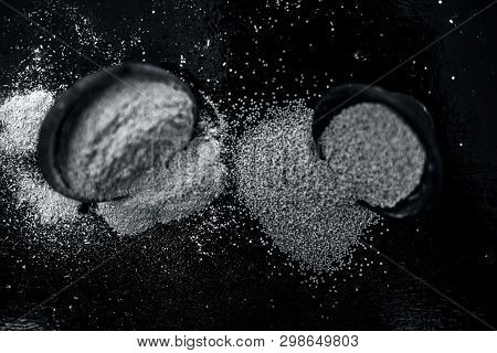 Close Up Of Clay Bowl On Wooden Surface Full Of Poppy Seeds Or Khus Or Opium Poppy Or Breadseed Popp