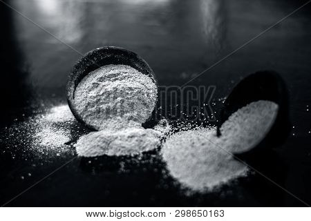 Close Up Of Clay Bowl On Wooden Surface Full Of Poppy Seeds Or Khus Or Opium Poppy Or Breadseed Popp