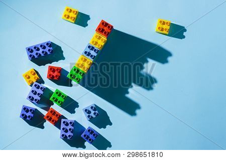 Multicolored Details From The Childrens Designer On A Blue Background. Flat Lay, Top View.