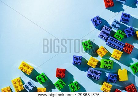 Multicolored Details From The Childrens Designer On A Blue Background. Flat Lay, Top View.
