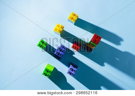 Columns From The Childrens Designer On A Blue Background. The Concept Of Building Houses, New Buildi