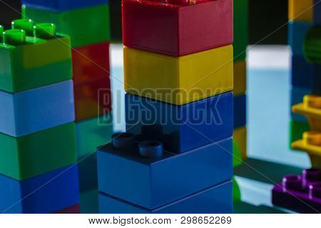 Columns From The Childrens Designer On A Blue Background. The Concept Of Building Houses, New Buildi