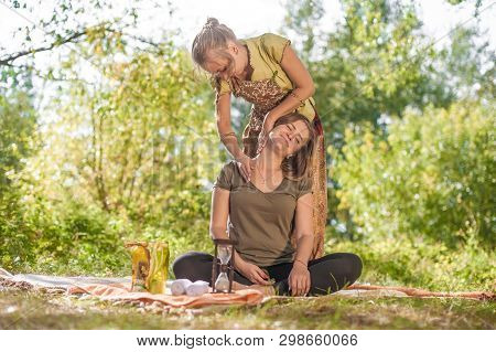Massage Trainer Thuroughly Massages A Girl In The Sunlight.