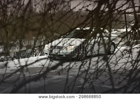 Kiev, Ukraine - November 22, 2018: Mercedes-benz S-class In Winter Among Tree Branches. Abstract Pho