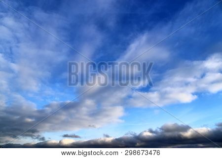 Beautiful Mixed Cloud Formations With White And Grey Cumulus Clouds In The Sunlight On A Blue Sky Se