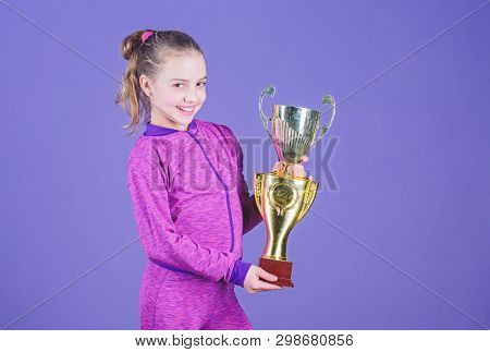 Adorable Cup Winner. Small Girl Holding Silver Cup. Little Child With Cup Shaped Sports Trophy. Cute