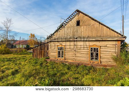 Milkovo, Kamchatka, Russia- 27 September 2014: View Of The Old Wooden, Abandoned Hose In Milkovo. To