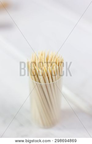 Bamboo Toothstick In A Case Over The White Table. Great Photo For Your Needs.