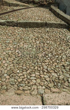 Rough Stone Pavement In Pathway Made Of Large Stairs, Forming A Singular Background At Alvoco Da Ser