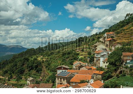 Charming Houses Going Up On The Hilly Landscape Covered By Trees And Terraced Fields At Alvoco Da Se