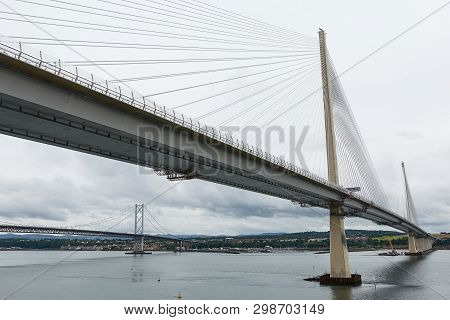 The New Queensferry Crossing Bridge Over The Firth Of Forth With The Older Forth Road Bridge In Edin