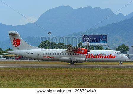 Airplane Taxiing On Runway