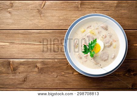 Traditional Polish Soup Zurek On Wooden Table