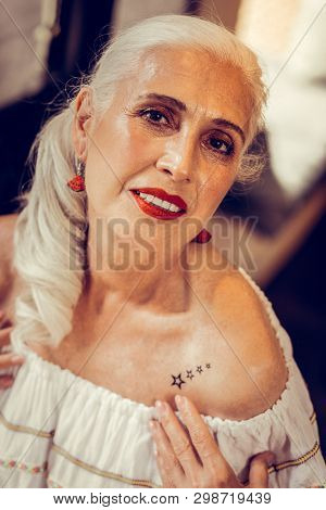 Languid Long-haired Old Woman Having Tied Hair