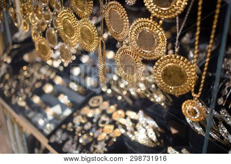 Golden Necklaces In Jewellery Shop Display With Ducats, Golden Coins. Skopje, North Macedonia