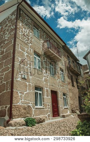 Alvoco Da Serra, Portugal - July 15, 2018. Facade Of Stone Wall House On A Cobblestone Alley At Alvo
