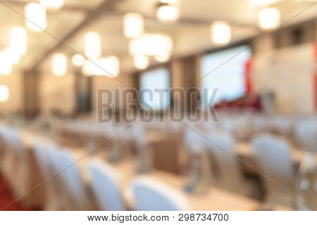 Seminar Or Townhall Meeting Blur Background In Hotel Conference Room With Audiences  And Speaker Pod