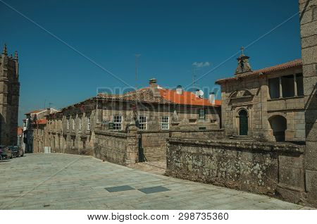 Guarda, Portugal - July 16, 2018. Old Stone Building With Walled Fence And Cobblestone Alley At Guar