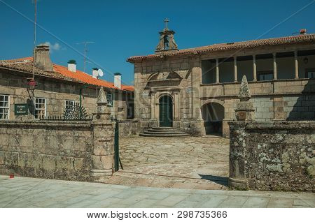 Guarda, Portugal - July 16, 2018. Old Stone Building With Walled Fence And Cobblestone Alley At Guar
