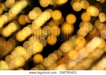 Abstract Blurred And Bokeh Of Reflection Lighting Of Light Bubs On Black Background.