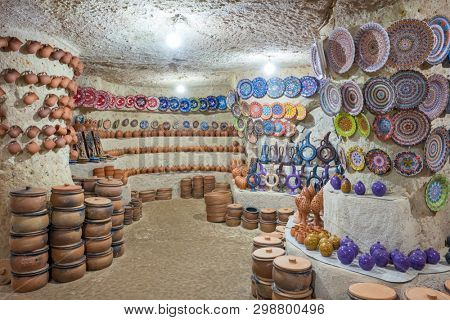 Avanos, Turkey - October 19, 2018: Turkish traditional ceramic pots and jars in underground ceramic shop located in Avanos, Cappadocia.