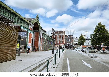 Lourdes, France - June 18, 2018: Place Du Champ Commun. Beautiful Buildings And сars Near The Food M