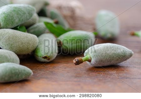 Stack Of Fresh Green Almond Nut Fruits On Table İn The Kitchen.