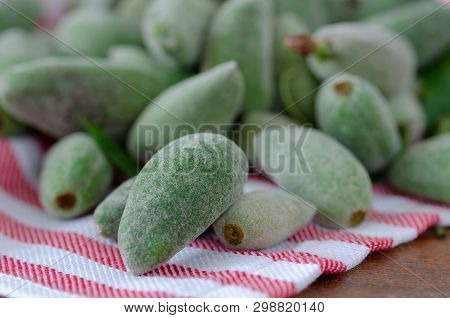 Stack Of Fresh Green Almond  Fruits On The Napkin İn The Kitchen.