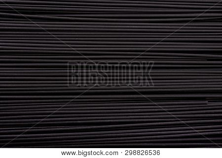 Black Pasta Background. Black Spaghetti With Squid Ink, Background. Pasta With Black Cuttlefish Ink.