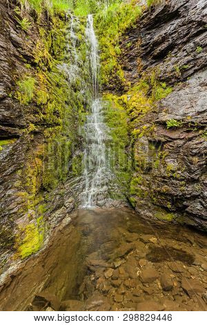 Little Waterfall In Green Summer Mountains, Norway.