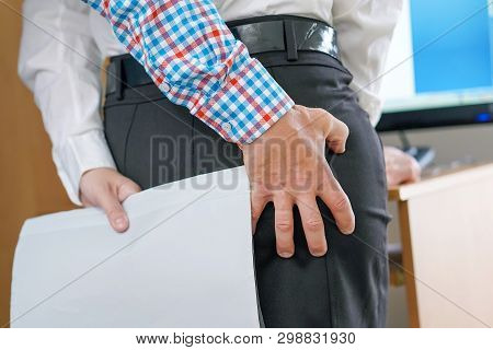 Man Touching Woman's Butt