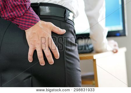 Man Touching Woman's Butt