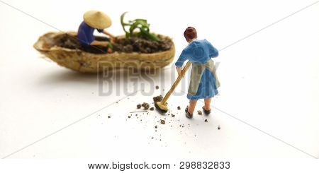 Conceptual Illustration, Keep Struggle, Mini Figure Man Farming At Limited Area, Peanut Skin, With W