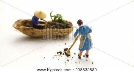 Conceptual Illustration, Keep Struggle, Mini Figure Man Farming At Limited Area, Peanut Skin, With W