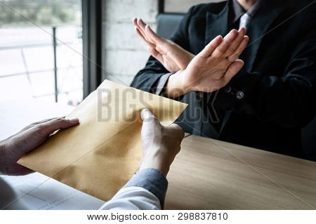 Anti Bribery And Corruption Concept, Business Man Refusing And Don't Receive Money Banknote In Envel