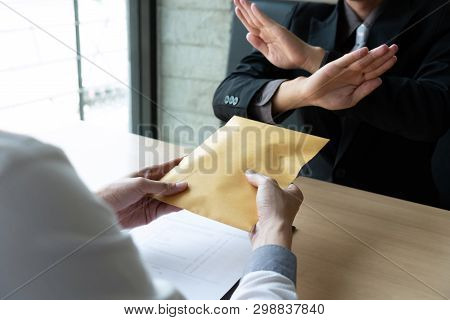 Anti Bribery And Corruption Concept, Business Man Refusing And Don't Receive Money Banknote In Envel