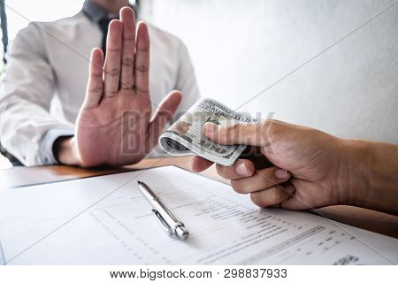 Anti Bribery And Corruption Concept, Business Man Refusing And Don't Receive Money Banknote In Envel