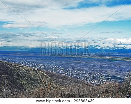 Top View Of Alazani Valley In Georgia In Springtime, In The Distance Through The Haze Visible To The