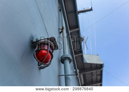 Old Vintage Lamp On Ship Deck Wall Surrounded By Metal Rustic. Bulkhead Light On Navy Ship And Blue 