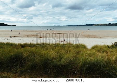 Tranquil Beach Against Cloudy Sky In Brittany