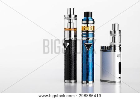 Electronic Cigarettes Or Vaping Devices On White Background