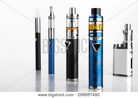 Electronic Cigarettes Or Vaping Devices On White Background
