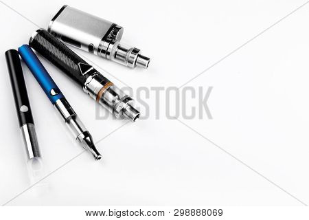 Electronic Cigarettes Or Vaping Devices On White Background