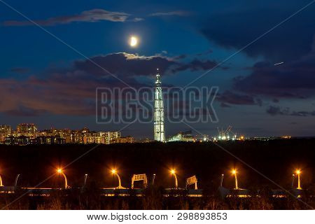 Night Cityscape. View Of The Lakhta Center Tower In St. Petersburg In The Sunset With Clouds And Moo