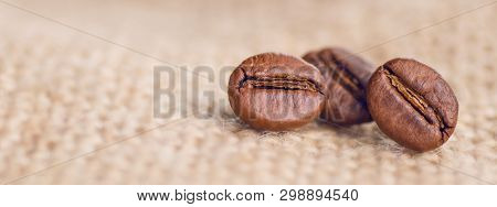 Cloceup Of Brown Roasted Coffee Beans Seeds On Burlap Textile Background Black Caffeine Drink And En