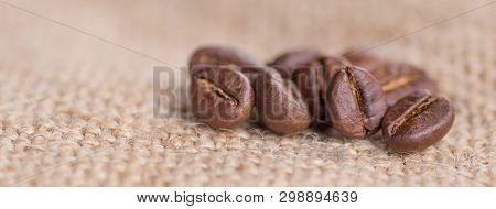 Cloceup Of Brown Roasted Coffee Beans Seeds On Burlap Textile Background Black Caffeine Drink And En