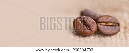 Cloceup Of Brown Roasted Coffee Beans Seeds On Burlap Textile Background Black Caffeine Drink And En