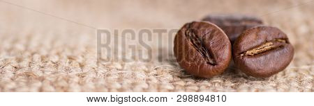 Cloceup Of Brown Roasted Coffee Beans Seeds On Burlap Textile Background Black Caffeine Drink And En