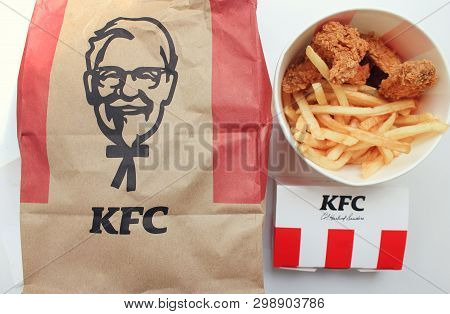 Kfc Fast Food Meal Of Classic Kentucky Fried Chicken Bucket With Wings And French Fries With Take Ou