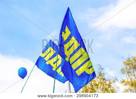 Samara, Russia - May 1, 2019: Flags Of Liberal Democratic Party Of Russia (ldpr) Against The Blue Sk